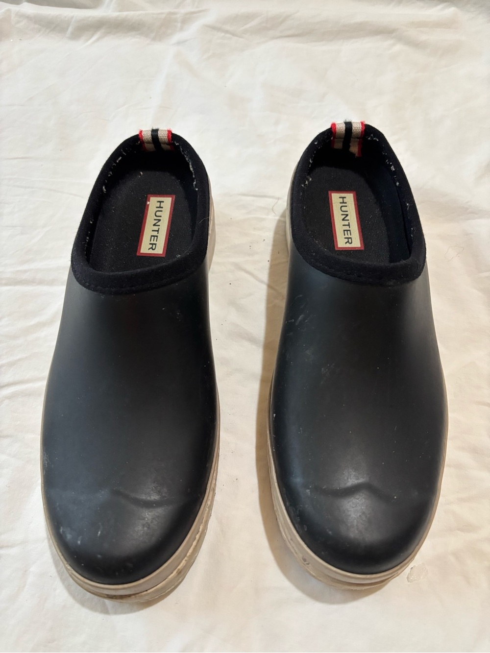 Hunter Black Slip-On Clogs with Cream Soles and Red Heel Tabs
